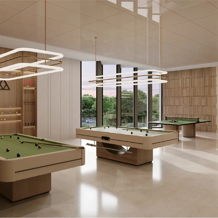 A games room with pool and table-tennis tables by tall windows at Orchid South Park